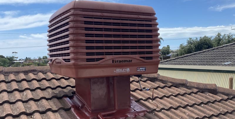 A roof-mounted evaporative cooler